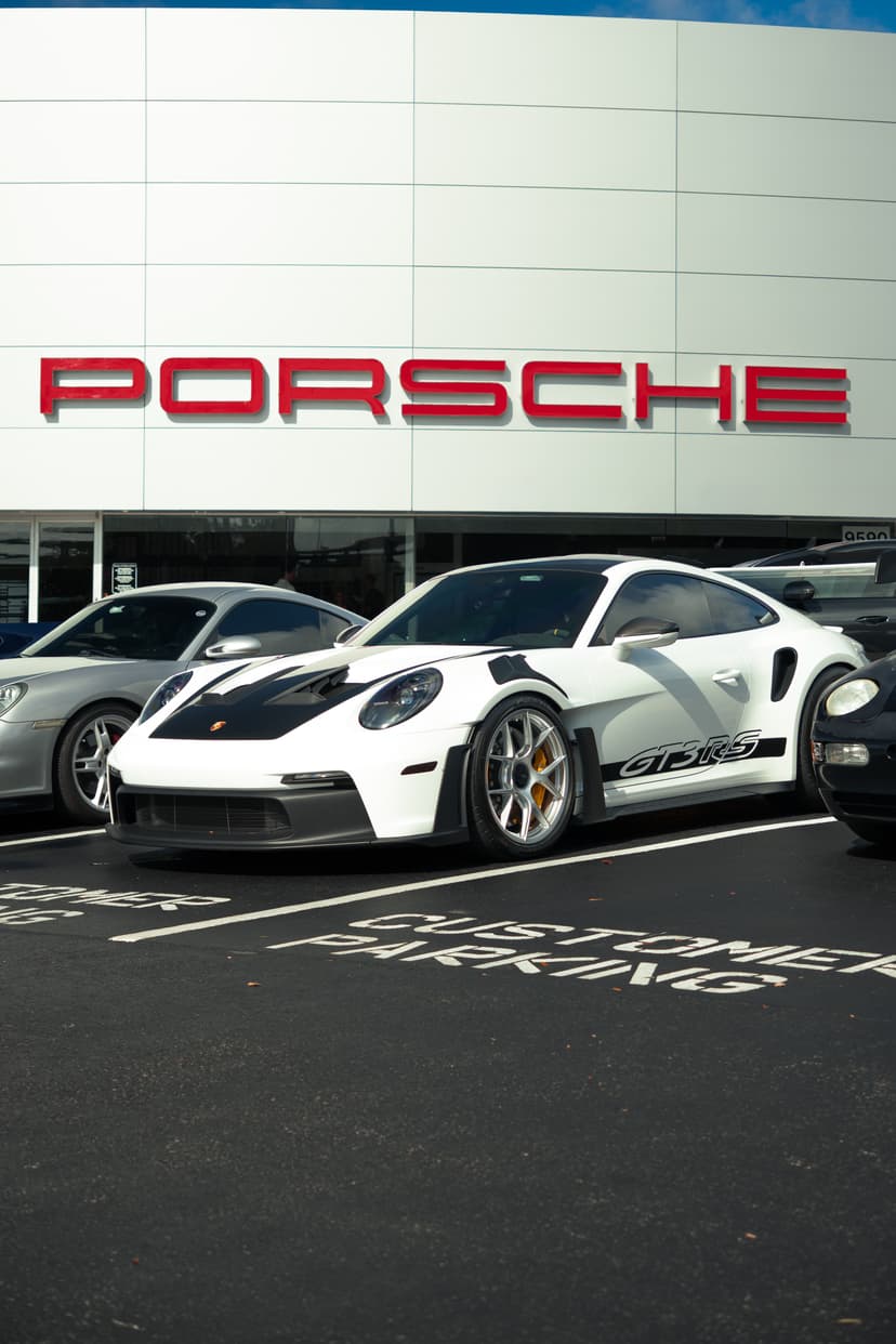 Porsche w/ dealership background